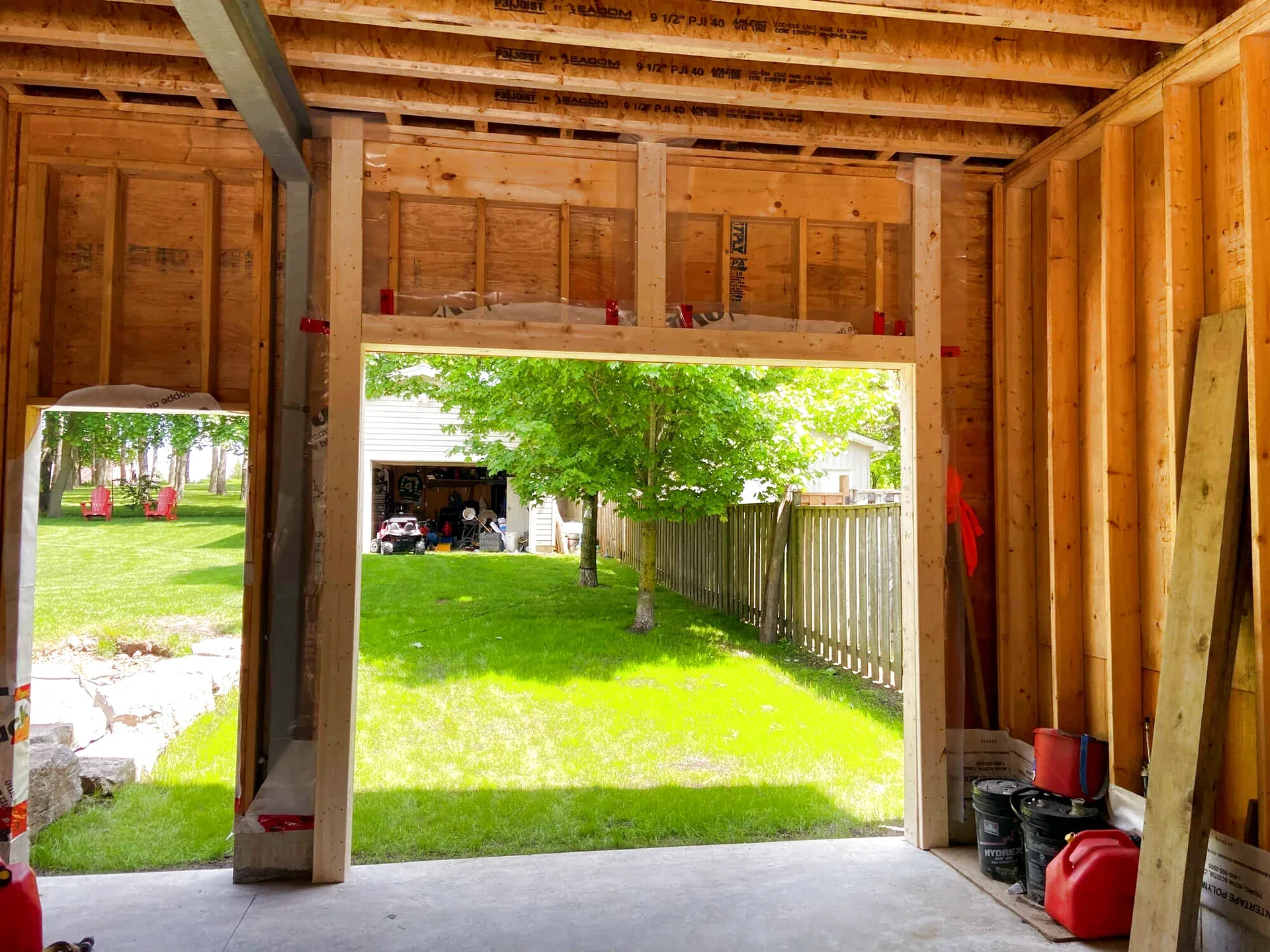 Rotted garage door wood jamb being replaced with pressure-treated lumber by Liftime in Ottawa